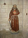 Statue de saint Antoine et son cochon, collégiale d'Uzeste en Gironde